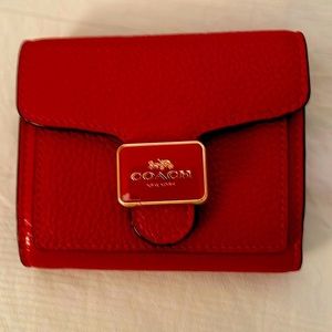 Red pebble leather Coach no-fold wallet